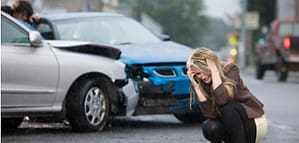 Woman crying in car accident