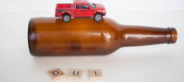 Car toy on bottle